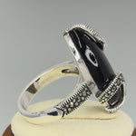 Sterling Silver Black Onyx Oval Wrap Marcasite Ring